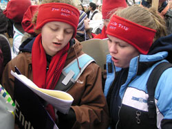 St. Malachy parishioners Christen Damier and Sarah Erdely of Brownsburg sing as they prepare to march for life on Jan. 22 in Washington. Christen is a senior at Brownsburg High School and Sarah is a sophomore at Cardinal Ritter Jr./Sr. High School in Indianapolis.