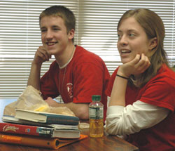 Danny Shine, left, and Eleanor McReynolds, right, both seniors at Bishop Chatard High School in Indianapolis, discuss their enthusiasm for encouraging vocational awareness through their participation in SERV (Students Encouraging Religious Vocations) at the school on March 8.