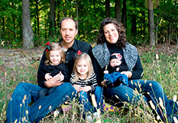 For Leron and Hannah Giesting, the early years of their marriage have been tested by unexpected, serious health concerns. Here, the Batesville farming couple poses for a family photo with their three daughters, Felicity, left, Nalley and Siena. (Submitted photo)