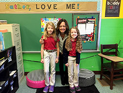 Annetta Brack shares a smile with Annie Hoff, left, and Marisa Marshall, two of her third-grade students at St. Michael School in Brookville. (Submitted photo)