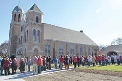 Parishioners of Sacred Heart Parish in Clinton gather for the consecration of their new Marian grotto, far right, as part of the celebration of the parish’s 125th anniversary on Nov. 6. (Submitted photos by Marcia Stengel)