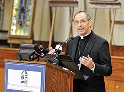 Archbishop-designate Charles C. Thompson speaks during a press conference on June 13 at the Archbishop Edward T. O’Meara Catholic Center in Indianapolis. Earlier in the day Pope Francis had named the Evansville bishop as the seventh archbishop of Indianapolis, succeeding Cardinal Joseph W. Tobin, who was appointed to lead the Archdiocese of Newark, N.J., last November. (Photo by Sean Gallagher)