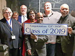 Society of St. Vincent de Paul members of St. Simon the Apostle Parish in Indianapolis and Divine Word Missionaries Father Charles Smith, Veterans Administration chaplain, celebrate with recent graduates of the first “Changing Lives Forever” program focused specifically on the needs of veterans on Nov. 25. Pictured are Phyllis Manfredi, left, program coordinator Domoni Rouse, Dave Kasberg, Brenda Ray, Paul Larkin, Landon “Red” Boyd and Father Smith. Not pictured is John Babcock. (Submitted photo)