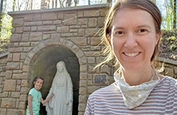 Julie Reyes and her daughter Ana celebrated “Mother-Daughter Day” together on May 1 at Camp Rancho Framasa in Brown County by visiting the camp’s new grotto to the Blessed Mother. The Catholic Youth Organization camp is one of the outdoor sacred spaces in the archdiocese that offers visitors fun places to explore, beautiful settings and opportunities to grow in faith. (Submitted photo)