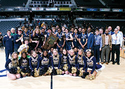 The boys’ basketball team of Cathedral High School in Indianapolis celebrates its state championship on March 26 at Gainbridge Fieldhouse in Indianapolis. (Submitted photo)