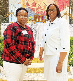 Johnette Grant, left, and her sponsor Gretchen Horne, members of Holy Angels Parish in Indianapolis, smile after Grant was received into the full communion of the Church during an Easter Vigil Mass at St. Rita Church in Indianapoils on April 16. (Submitted photo)