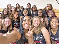 Being part of a team has always been an important part of the high school experience for Stella Campbell, second from right, front row. Here, she shares a moment of fun with basketball teammates at Cardinal Ritter Jr./Sr. High School in Indianapolis. (Submitted photo)