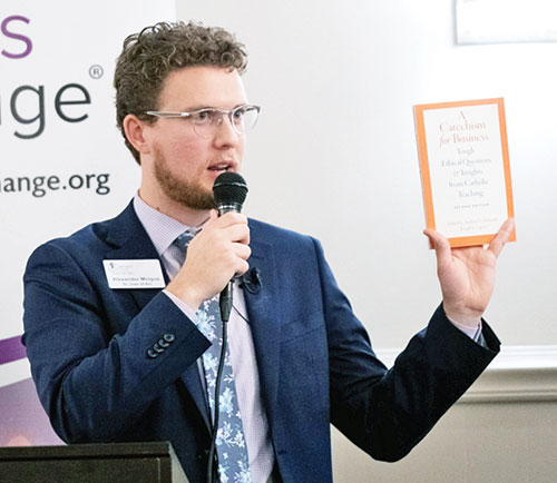 Alexander Mingus, associate director of the Indiana Catholic Conference and soon to be its director, addresses a gathering of the Catholic Business Exchange in Indianapolis in October 2023. (Photo credit Denis Kelly)